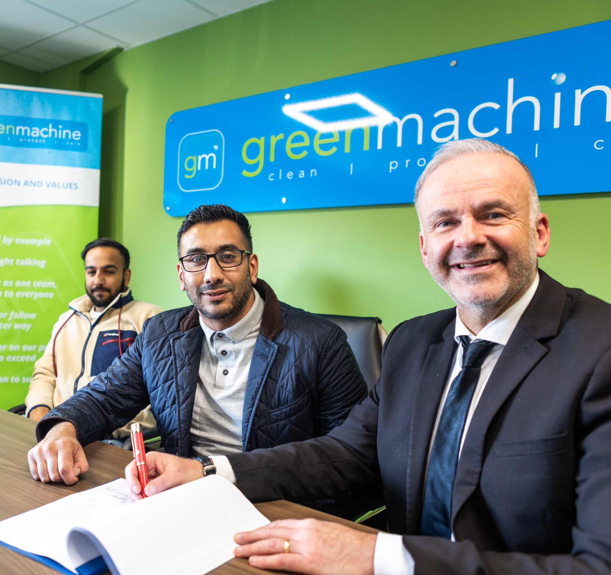A Green Machine franchise agreement signing